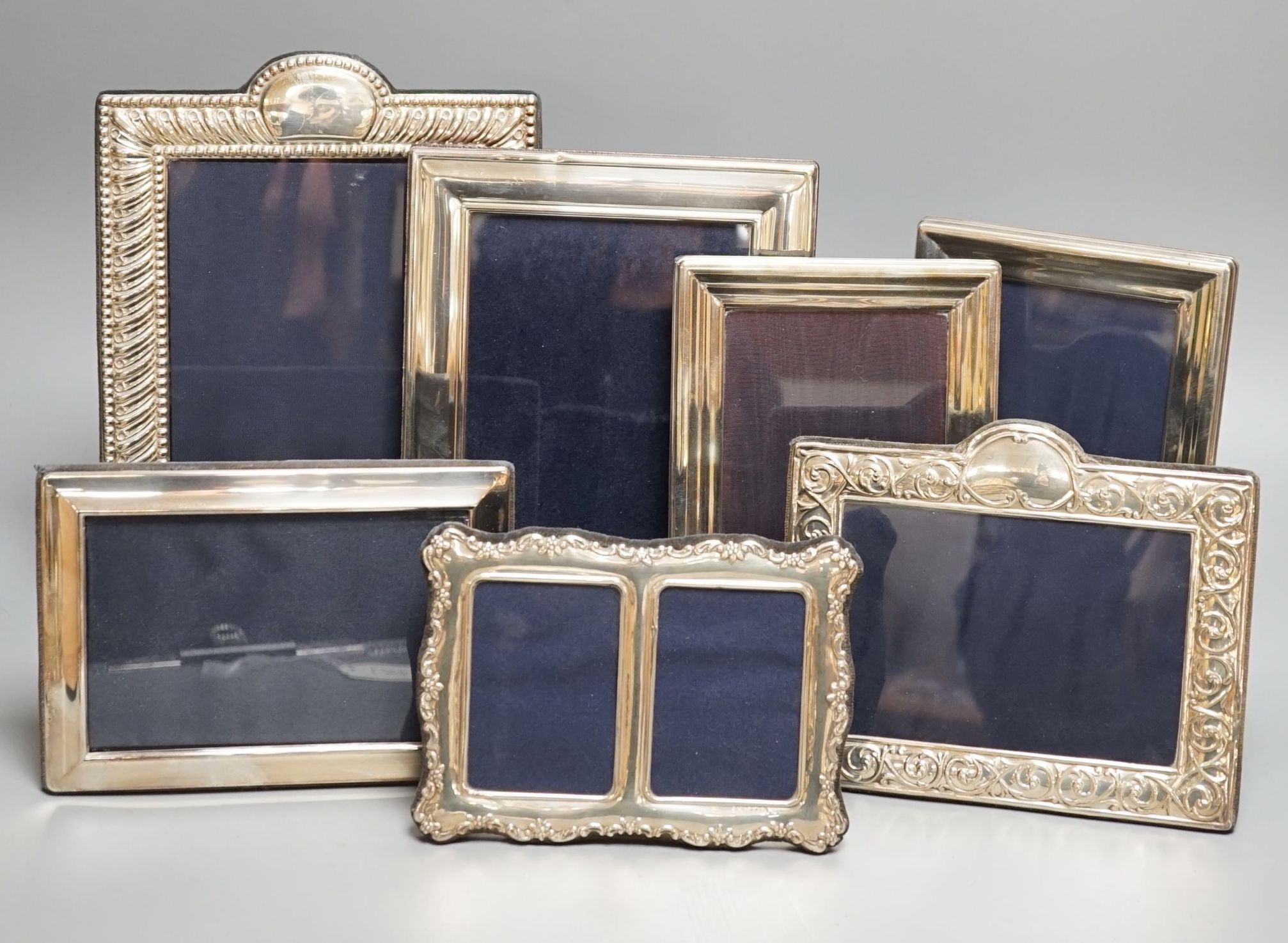 Seven assorted modern silver mounted photograph frames including a pair by JD Ltd, Birmingham, 2000, largest frame, 25.6cm